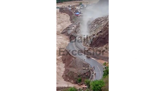 Jammu-Sringar highway badly damaged due to flooded Tawi and landslides near Samroli in Udhampur. - Excelsior/K.Kumar