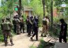 Security personnel at the school where militants shot dead a teacher at Gopalpora in Kulgam on Tuesday. (UNI)