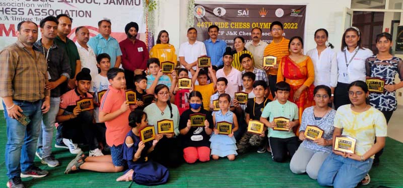 Players displaying trophies while posing with dignitaries at IDPS School Jammu on Saturday.