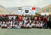 Participants of mini marathon posing for a group photograph alongwith dignatries at Leh on Tuesday.