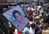 Govt employees carrying photo of teacher Rajni Bala staging protest in Jammu. — Excelsior/Rakesh