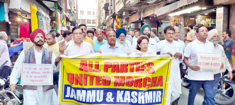 Leaders of various political parties taking out peace march at Jammu city on Monday.