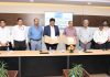 Officials of NHPC and M/s Adani Infra India Limited during signing of contract agreement.