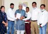 Jammu based reserved category employees of Kashmir submitting a memorandum to Lt Governor Manoj Sinha on Tuesday.