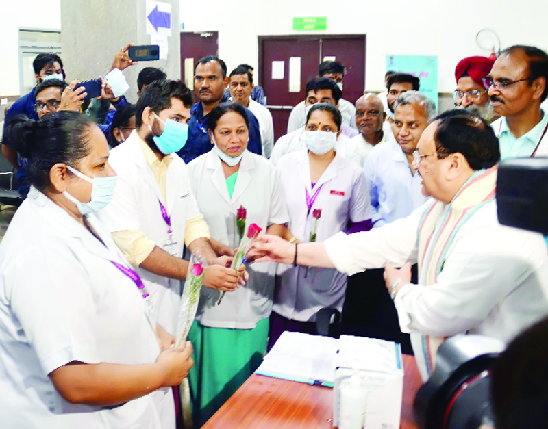 BJP National President J P Nadda visiting Lady Hardinge Hospital vaccination centre to see the Free Booster Dose campaign, in New Delhi on Wednesday. (UNI)