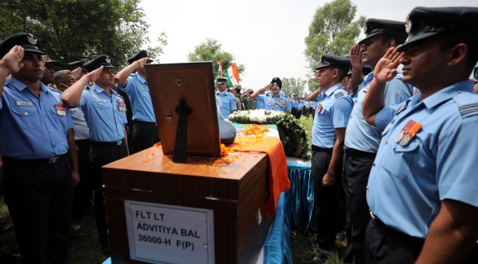 IAF officers offering salute to their martyr colleague at R S Pura in Jammu on Saturday. — Excelsior/Rakesh