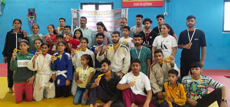 Winners displaying medals while posing with dignitaries at Subash Stadium in Udhampur on Thursday.