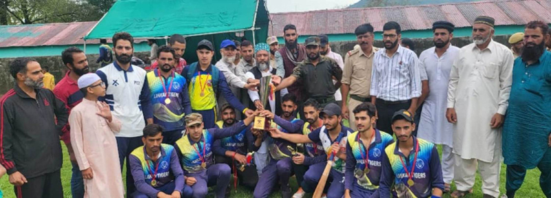 Winners being awarded with a trophy by dignitaries at Mendhar on Tuesday.
