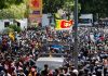 Demonstrators gather outside the office of Sri Lanka's Prime Minister Ranil Wickremesinghe on Wednesday.