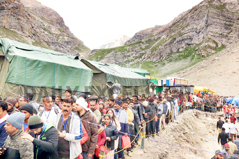 Huge rush of pilgrims near holy cave of Shri Amarnath Ji on Friday. -Excelsior/Shakeel