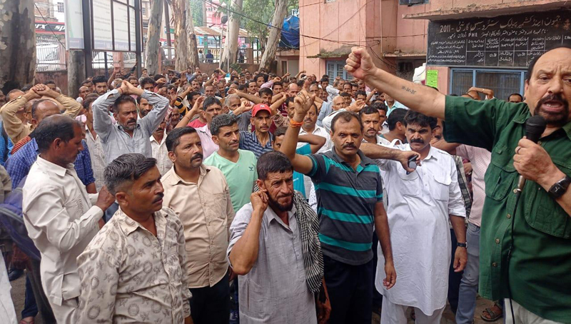PHE workers staging protest demonstration at Udhampur on Wednesday.