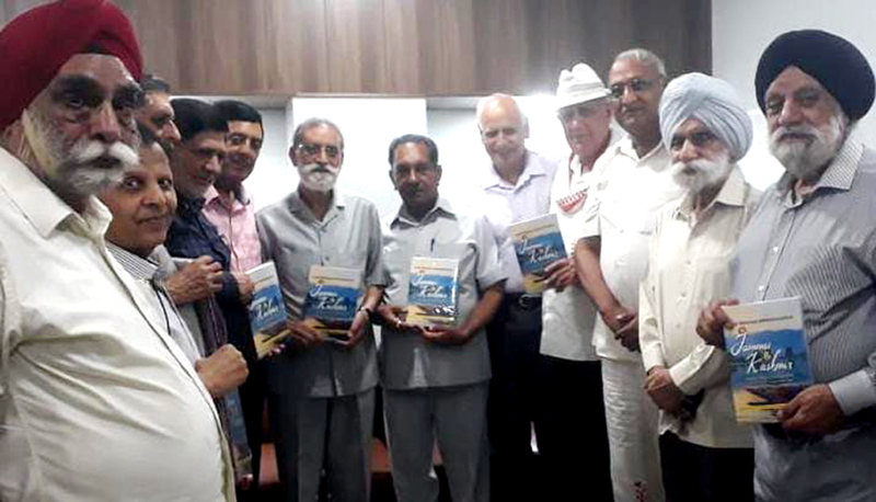 Former J&K Chief Secretary Dr S S Bloeria and others during release of a book on Land Revenue Administration.