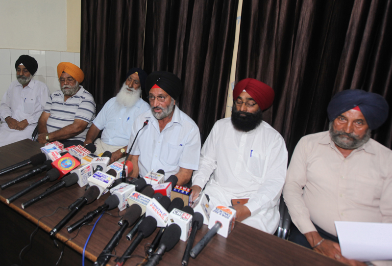 Contested candidate Sukhjit Singh, flanked by others addressing press conference in Jammu on Saturday. -Excelsior/ Rakesh