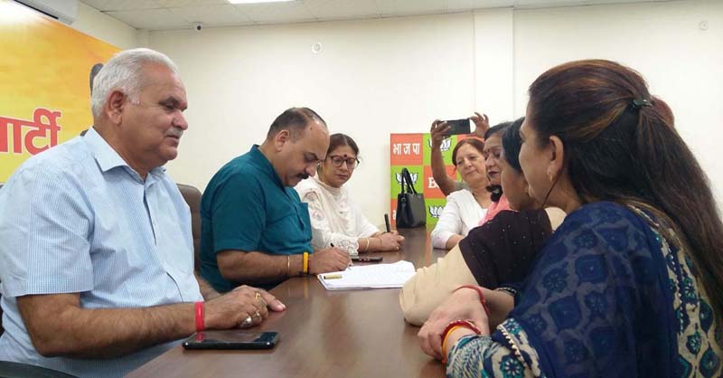 BJP leaders listening public grievances at party Headquarters Jammu on Friday.