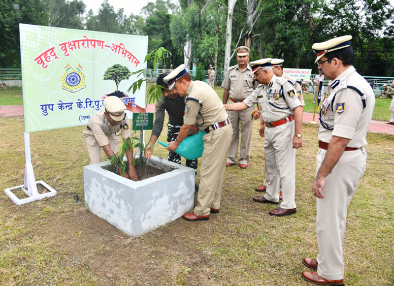 Inspector General CRPF J&K Zone, Diwan Singh Negi along with other officers planting a sapling at Group Centre in Jammu on the occasion of Raising Day on Wednesday. (UNI)