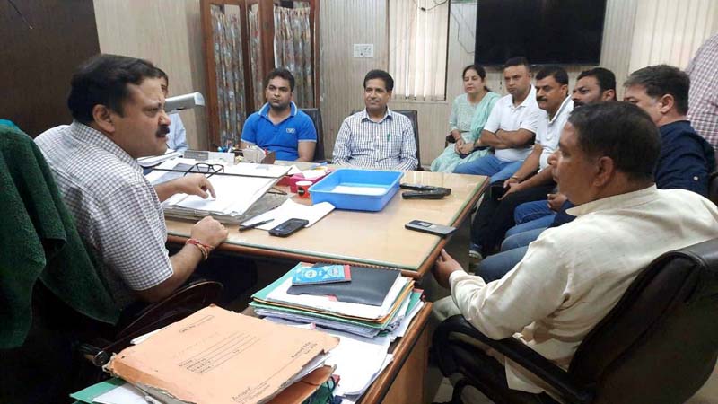 Former BJP president Sat Sharma and other party leaders during a meeting with Chief Engineer , Jal Shakti, Manish Bhat at Jammu on Thursday.