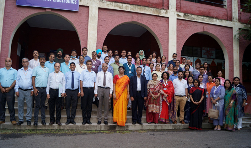 NAAC Peer team posing with Principal and other faculty members of GGM Science College, Jammu.