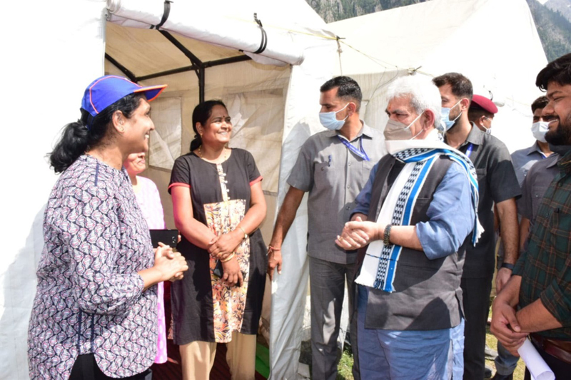LG Manoj Sinha interacting with pilgrims at Baltal yatra base camp on Monday.