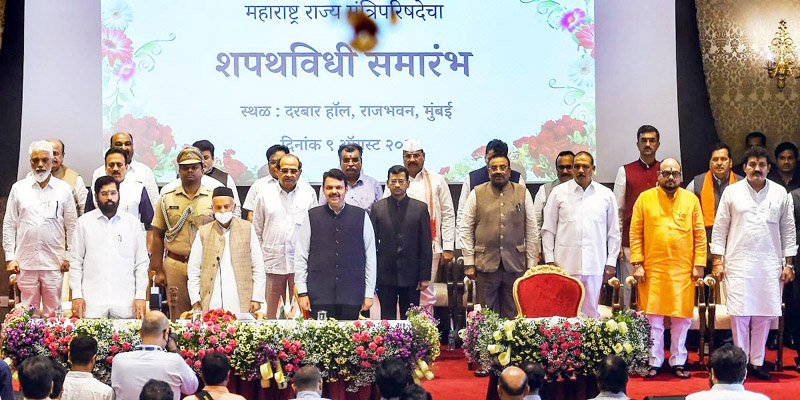 Maharashtra governor Bhagat Singh Koshyari, chief minister Eknath Shinde and deputy chief minister Devendra Fadnavis with newly sworn-in ministers, at a ceremony at Raj Bhavan in Mumbai.