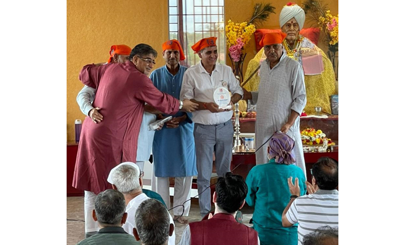 Founder Director, Radio Sharda Jammu and president Pir Panchal, Ramesh  Hangloo being awarded by Bhagawaan Gopinatn Ji Trust Bangalore for his  services to the community. The award was given to him for