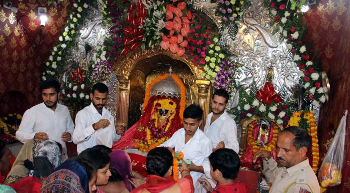 Devotees pay obeisance at Bawe Wali Mata temple in Jammu on Monday. -Excelsior/Rakesh
