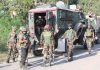 Troops at the site of encounter at Anantnag on Tuesday. -Excelsior/Sajad Dar