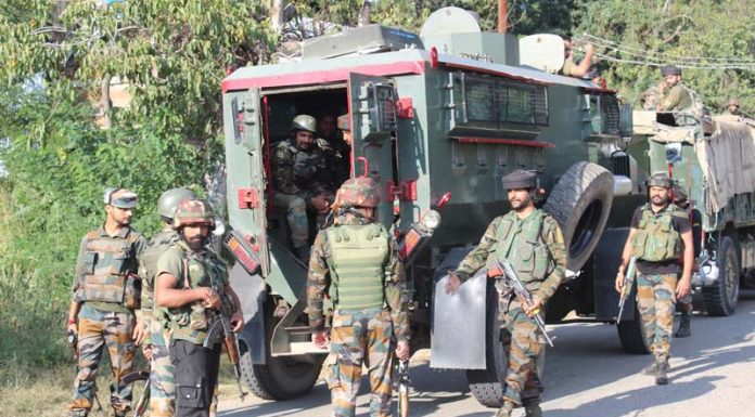 Troops at the site of encounter at Anantnag on Tuesday. -Excelsior/Sajad Dar