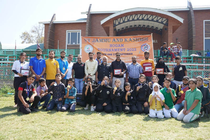 Winners displaying medals while posing for a group photograph at Srinagar on Wednesday.