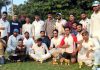 Winning team posing for a group photograph with trophies and match officials at KC Ground Jammu on Tuesday.