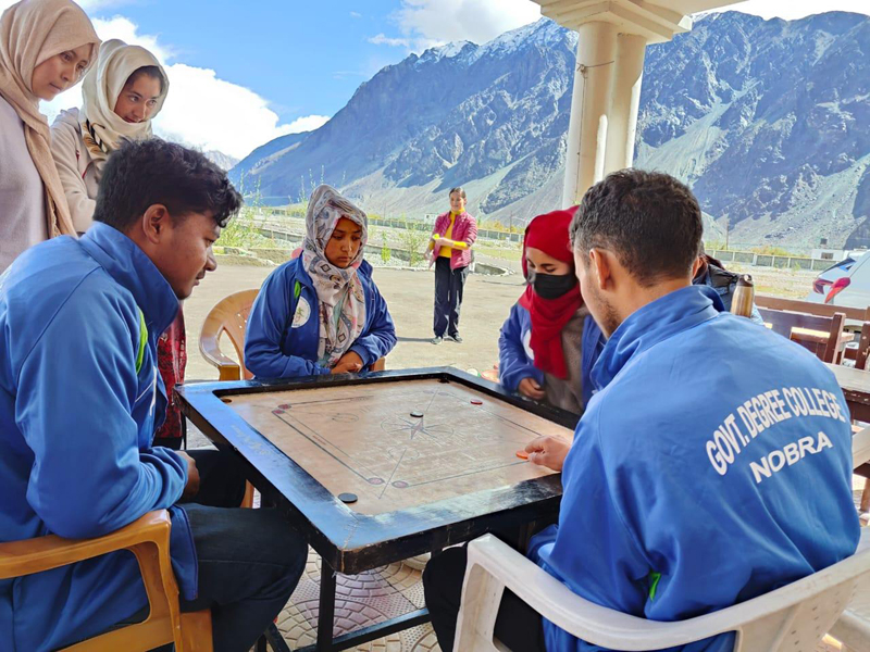Players playing a carrom game at GDC Nubra.