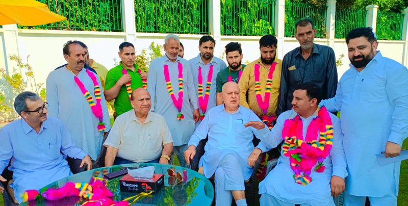 NC President and MP Dr Farooq Abdullah and new entrants posing for group photograph.