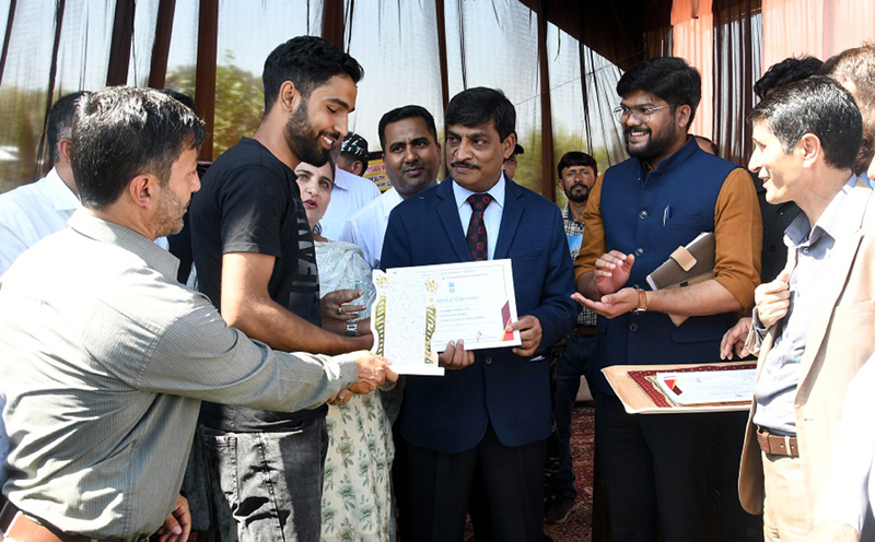 CS Dr Arun Kumar Mehta felicitating NEET qualifiers in Ganderbal.