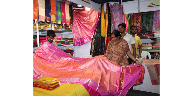A customer during 14 days Silk India Exhibition at Kala Kendra, Jammu. -Excelsior/Rakesh