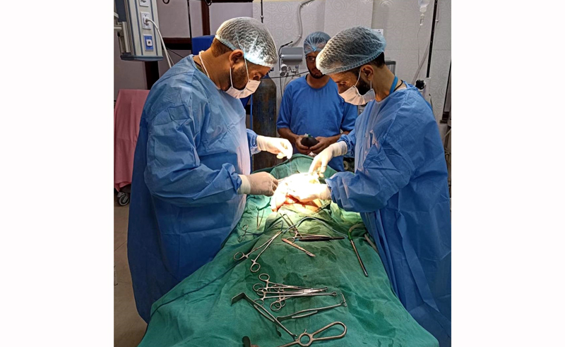 Doctors operating a child for Ascariasis in District Hospital Poonch.