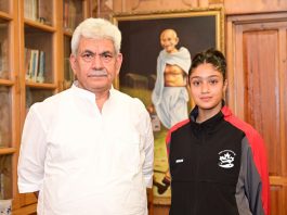 Gold Medallist Sadia Tariq posing with LG Manoj Sinha at Raj Bhawan Srinagar on Friday.