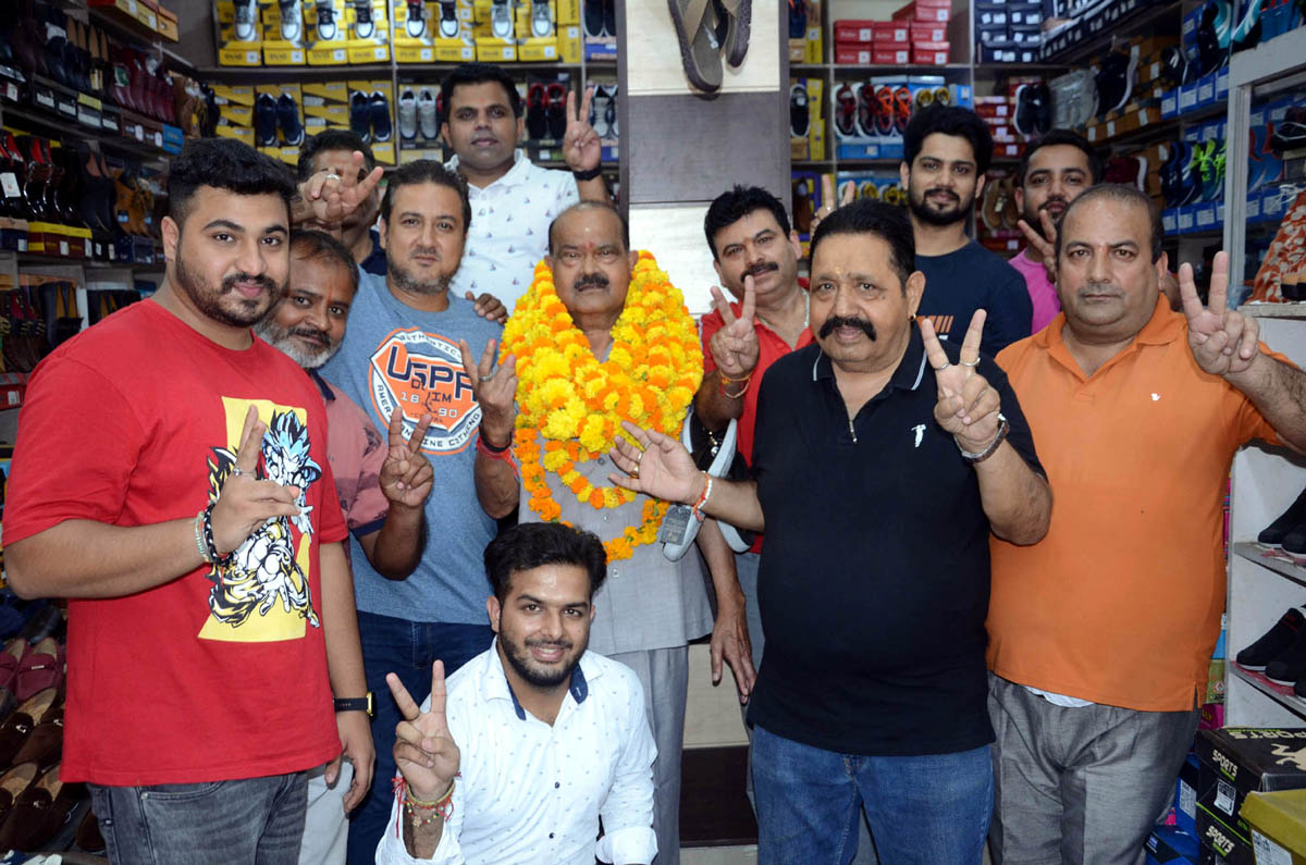 Members of Traders Association of Upper Gumat Bazar posing for a group photograph at Jammu on Tuesday.