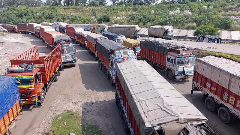 Long queues of trucks stranded due to traffic jam on Jammu-Pathankot NH at Lakhanpur on Friday. -Excelsior/Pardeep
