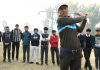 Fayaz Ahmad, a renowned Golf coach, teaches children the perfect Golf swing at Kashmir Golf Course.— Excelsior/Shakeel