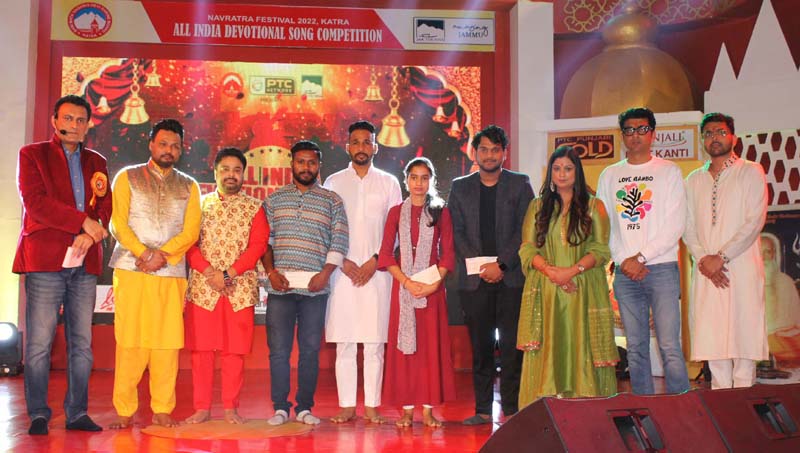 Winners of Devotional Song Contest posing a group photograph with playback singer Richa Sharma and others at Katra on Saturday.