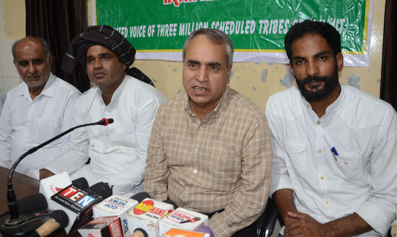 Leaders of Gujjar-Bakarwal organizations addressing a press conference at Jammu on Monday.