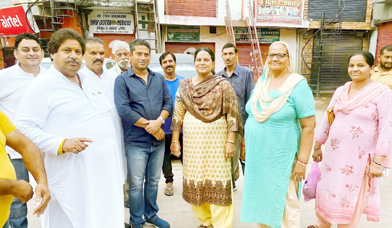 Raman Bhalla meeting with people at Bahu Fort area on Saturday.