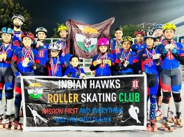 Skaters displaying medals while posing for a group photograph at MA Stadium Jammu.