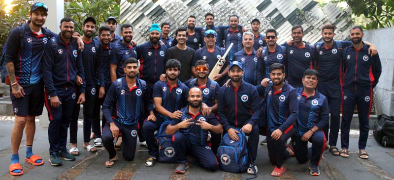 J&K team posing for a group photograph alongwith coach and other supporting staff in Ahmedabad on Saturday.