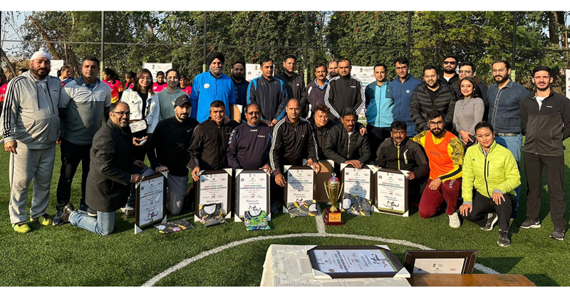 Divisional Commissioner Ramesh Kumar posing with players and organisers during inaugural ceremony of ‘Mirchi Football League’ at Jammu on Sunday.