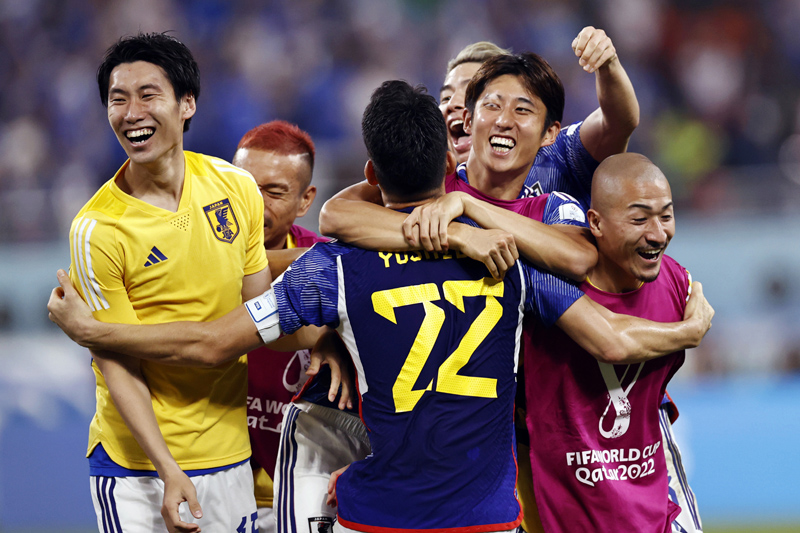 Japan team players celebrate after beating Spain by 2-1 in the FIFA World Cup 2022, at Khalifa International Stadium in Al Rayyan on Friday.