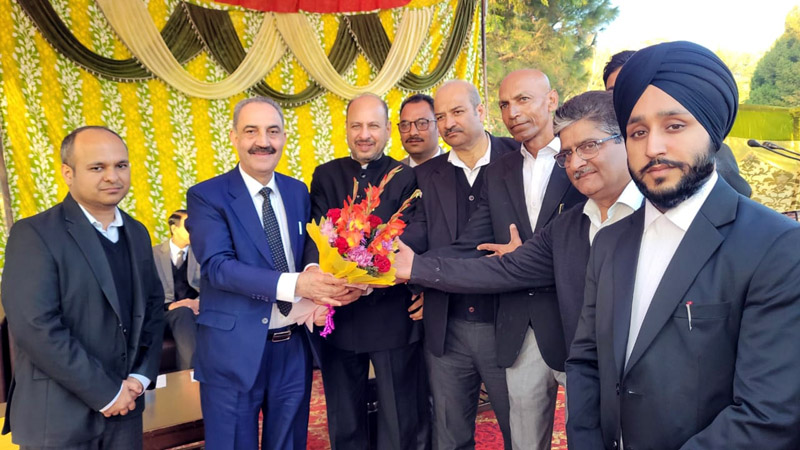 A bouquet is being presented to Chief Justice Ali Mohd Magrey during the prize distribution function at Jammu on Tuesday.
