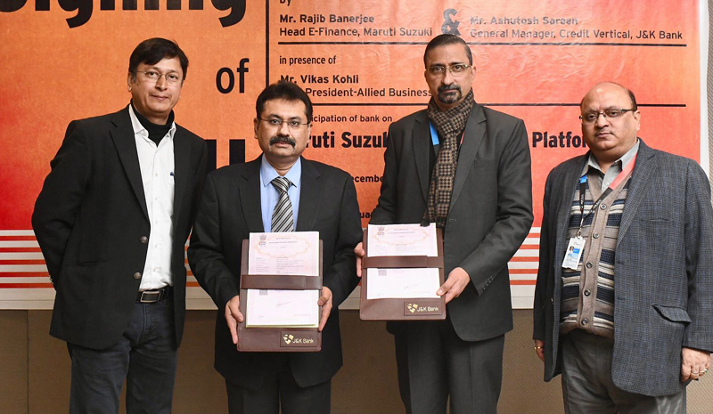 Vikas Kohli, Vice President (Allied Business), Maruti Suzuki India Ltd and Ashutosh Sareen, General Manager, J&K Bank with their team on the occasion of signing of agreement.