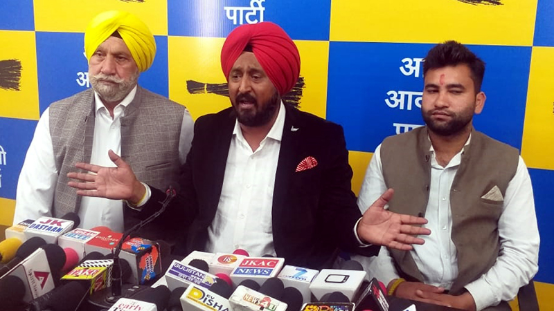 AAP leader T S Tony addressing a press conference at Jammu on Friday.