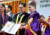 Union Law and Justice Minister Kiren Rijiju with Tamil Nadu Governor RN Ravi presents a certificate at the 12th Convocation ceremony of Ambedkar Law University, in Chennai.