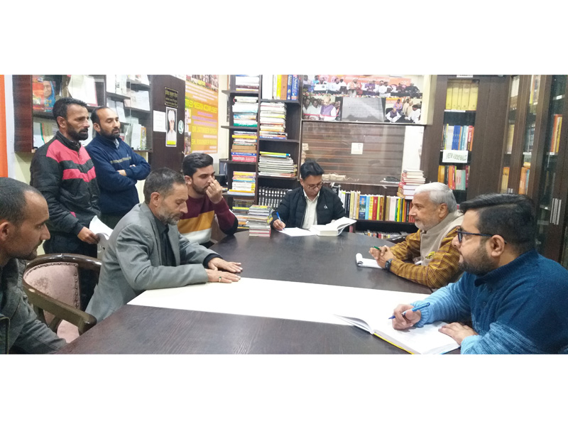 Former Minister and BJP vice president JK UT, Sham Lal Sharma listening to public grievances at party office Jammu on Thursday.